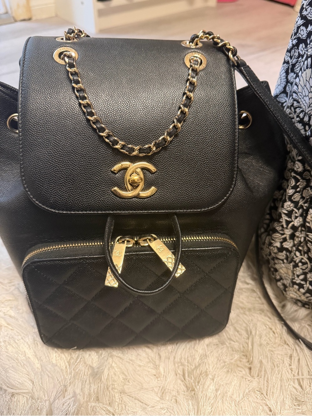 CHANEL Black Quilted Leather Backpack with Gold Hardware and Chain Straps